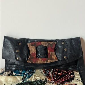 Inherited leather vintage clutch with engraved wood and stud accents